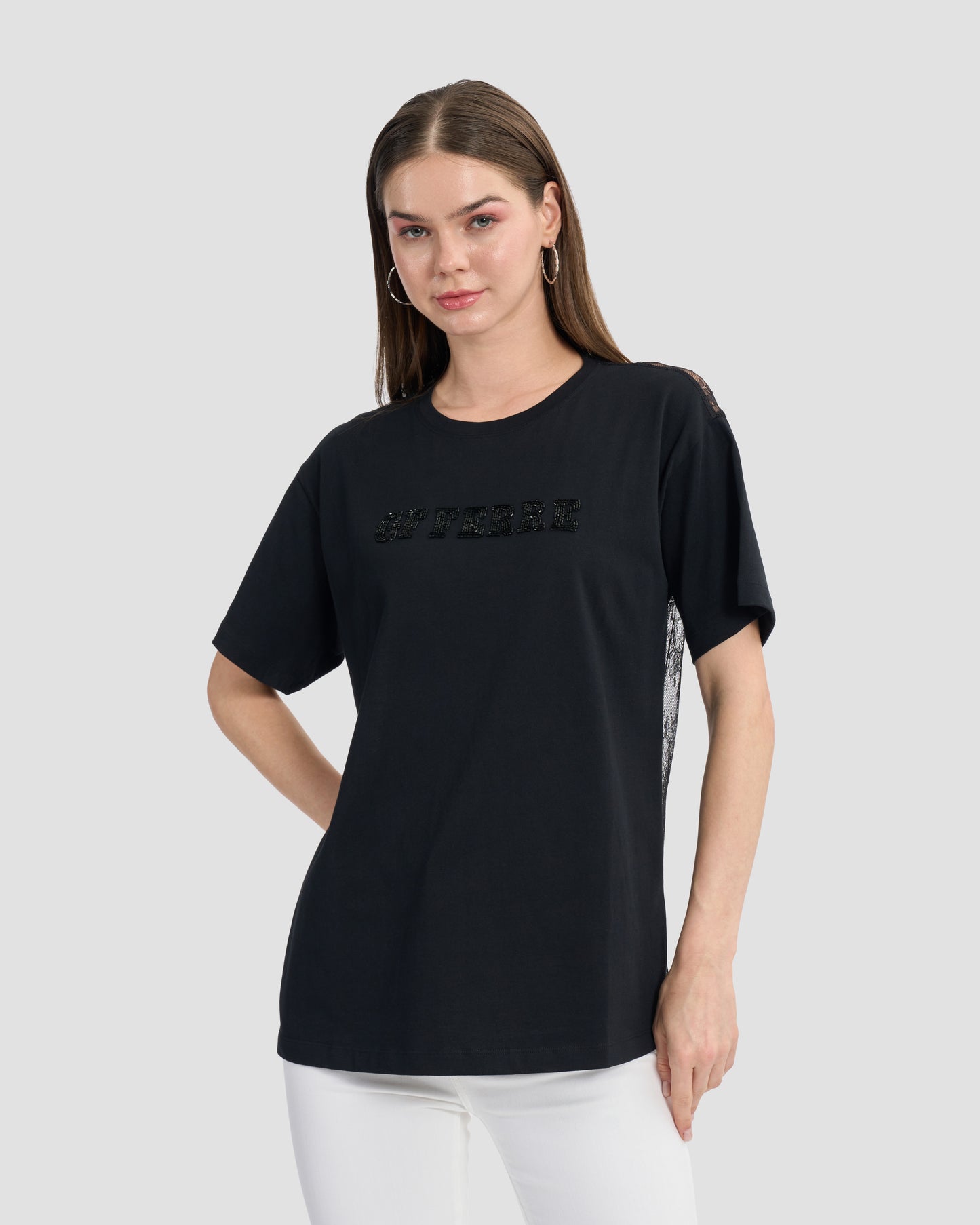 Round neck black t-shirt with lace back and finished off with a beaded Ferré to front.