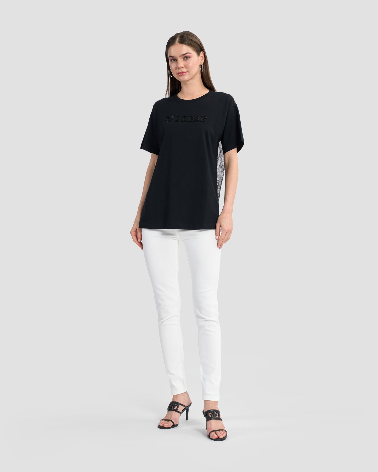 Round neck black t-shirt with lace back and finished off with a beaded Ferré to front.
