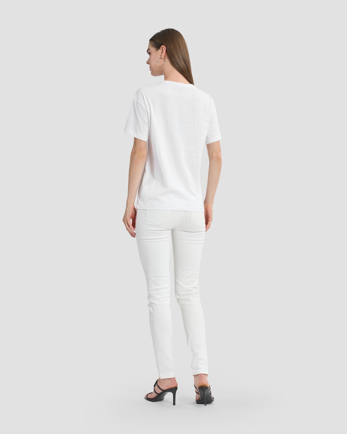 Round neck white t-shirt with rhinestones embellished Ferré branding to front.